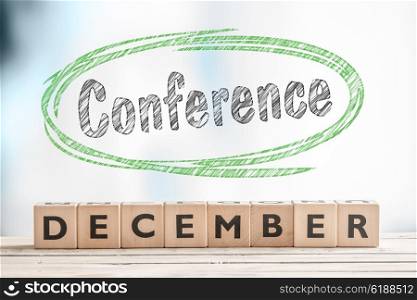 December conference sign on a stage made of wood