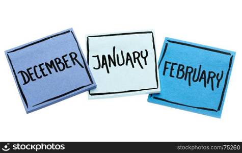 December, January and February - handwriting in black ink on isolated sticky notes