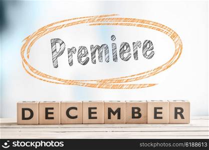 December premiere sign on a stage made of wood