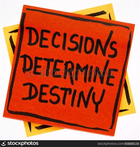 decisions determine destiny reminder or concept - handwriting in black ink on an isolated sticky note