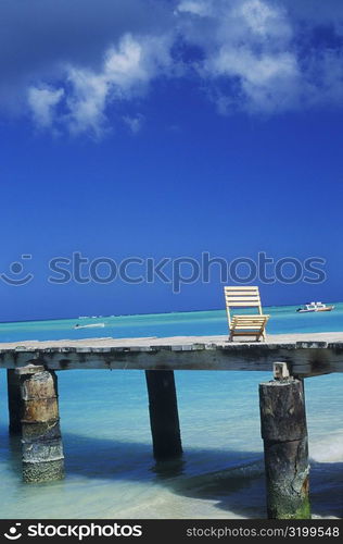 Deck chair on a pier, Caribbean