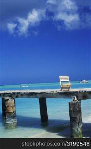 Deck chair on a pier, Caribbean