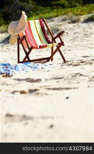 Deckchair and sunhat on beach