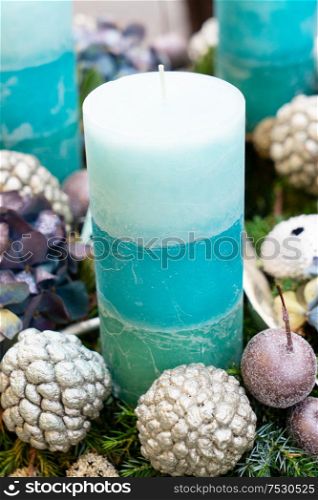 Decorated advent green pastel candle close up. Decorated advent candles