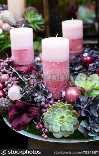 Decorated advent wreath with purple candles close up. Decorated advent candles