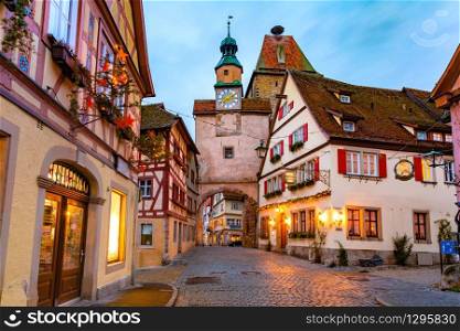 Decorated and illuminated Christmas street with gate and tower Markusturm in medieval Old Town of Rothenburg ob der Tauber, Bavaria, southern Germany. Christmas Rothenburg ob der Tauber, Germany