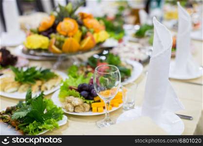 Decorated banquet wedding table setting on evening reception