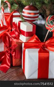 Decorated Christmas tree and gift boxes background. Decorated Christmas tree