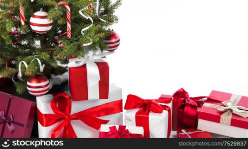 Decorated Christmas tree and gift boxes isolated on white background. Decorated Christmas tree