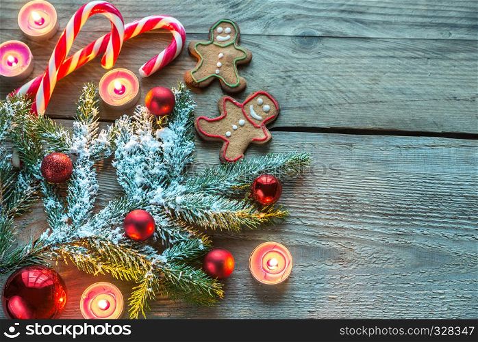 Decorated Christmas tree branch with cookies and candies