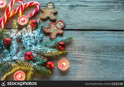 Decorated Christmas tree branch with cookies and candies