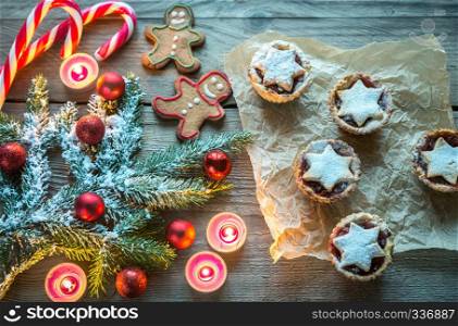 Decorated Christmas tree branch with holiday pastry