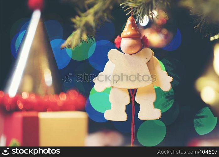 Decorated Christmas tree on blurred, sparkling and fairy background, vintage filter image