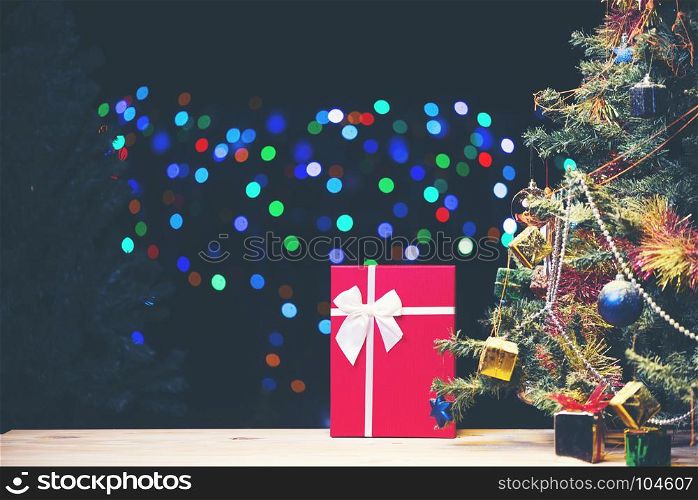 Decorated Christmas tree on blurred, sparkling and fairy background, vintage filter image