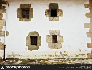 Decorated Closed Windows of Old Building in Spain