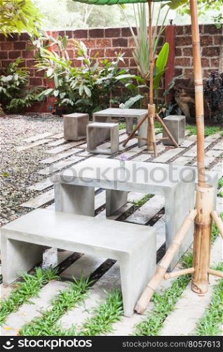 Decorated concrete table and chair in coffee shop, stock photo