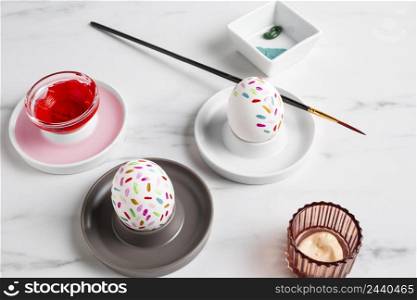 decorated easter egg plate with paintbrush paint