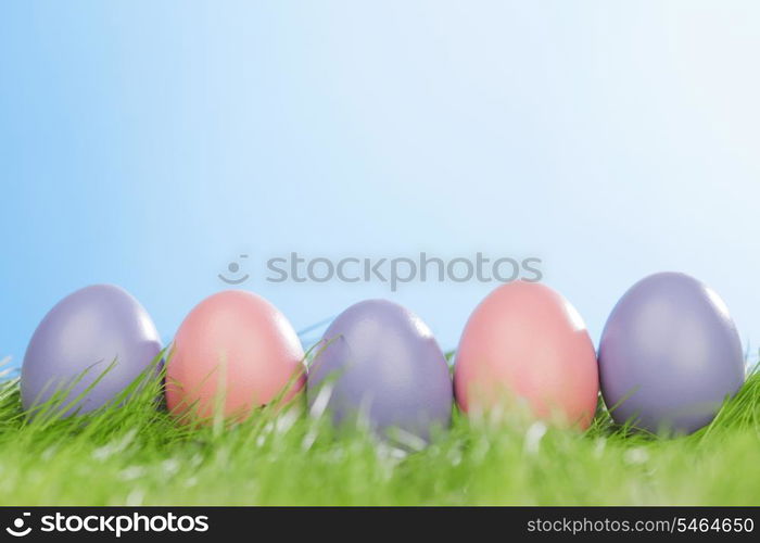 Decorated easter eggs in spring green grass