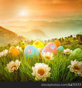 Decorated easter eggs in the grass on the background of sky