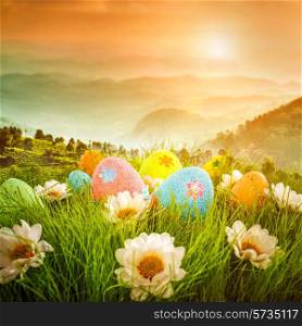 Decorated easter eggs in the grass on the background of sky