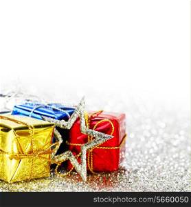 Decorated holiday gifts on silver background
