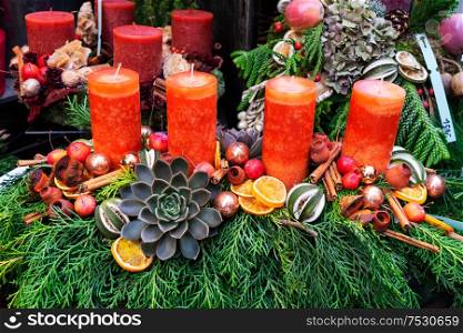 Decorated orange advent candles, christmas market shop in Vienna. Decorated advent candles