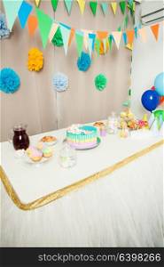 Decorated table in the room for Happy Birthday Party without people. Happy Birthday decoration