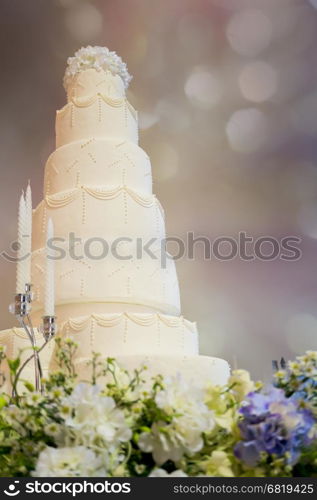Decorated wedding cake in luxury ballroom&#xA;
