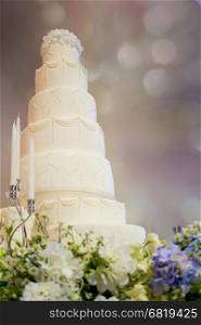 Decorated wedding cake in luxury ballroom&#xA;