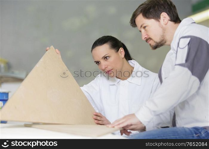 decorating team holding wooden templates