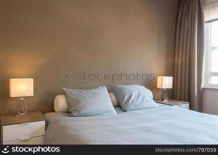 decoration and design of modern bedroom, warm brown colors close-up. decoration and design of modern bedroom, warm brown colors