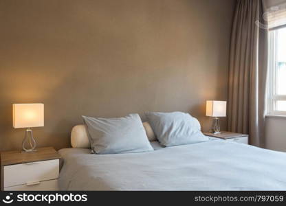 decoration and design of modern bedroom, warm brown colors close-up. decoration and design of modern bedroom, warm brown colors