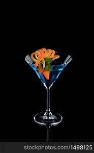 Decoration for a cocktail of orange and mint. Elegant and original presentation. Martini Blue Curacao on a black background