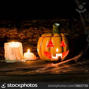 decoration for the hallowen celebration with pumpkins, spiders, candles on rustic wood. decoration for the celebration of hallowen with pumpkins, spiders, candles