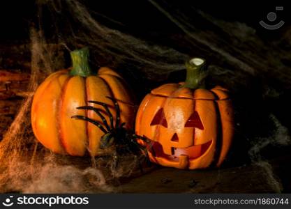 decoration for the hallowen celebration with pumpkins, spiders, candles on rustic wood. decoration for the celebration of hallowen with pumpkins, spiders, candles