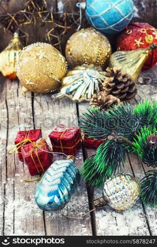 Decoration for the new year. Christmas decoration for decorations on snowy wooden background.Photo tinted.