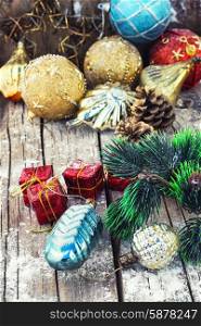 Decoration for the new year. Christmas decoration for decorations on snowy wooden background.Photo tinted.