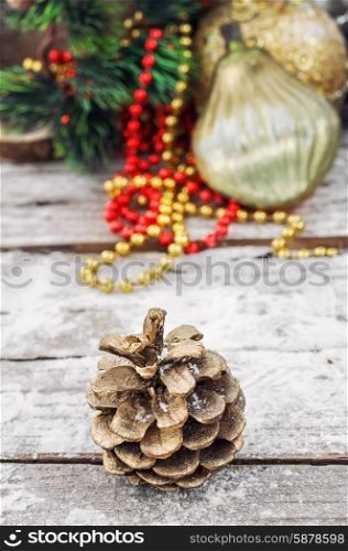 Decoration for the new year. pine cones on the background of snow-covered Christmas ornaments