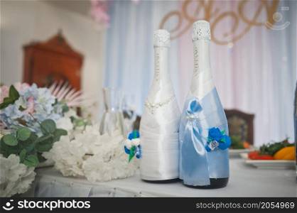 Decoration of champagne bottles for a wedding.. Bottles of champagne in the costumes of the newlyweds 2770.