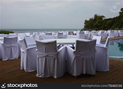 Decoration of wedding chairs and tables at the seaside