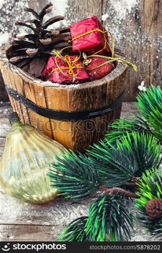 Decorations for Christmas. wooden tub with pine cones and Christmas decorations and ornaments.Selective focus