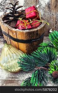 Decorations for Christmas. wooden tub with pine cones and Christmas decorations and ornaments.Selective focus