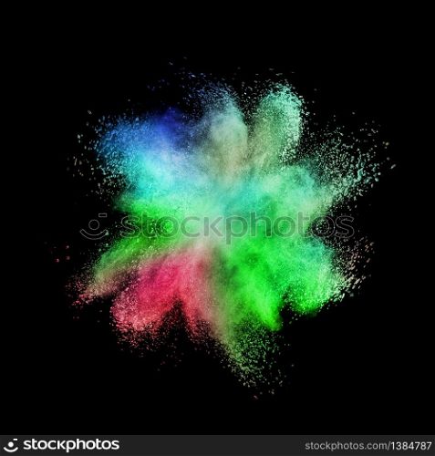 Decorative abstract multicolored powder splash or explosion on a black background with copy space.. Chaotic multicolored powder explosion on a black background.