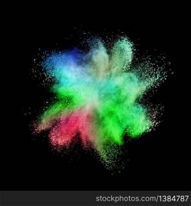Decorative abstract multicolored powder splash or explosion on a black background with copy space.. Chaotic multicolored powder explosion on a black background.