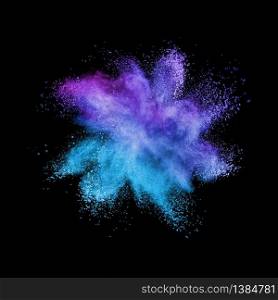Decorative abstract powder burst or explosion in blue and violet colors on a black background with copy space.. Abstract multicolored powder splash on a black background.