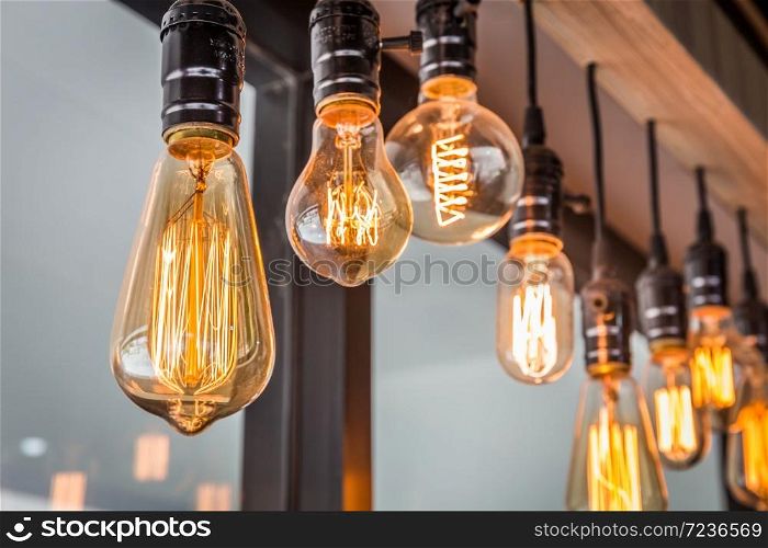 Decorative antique edison style filament old lighting decor bulb in modern building. Select focus