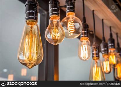 Decorative antique edison style filament old lighting decor bulb in modern building. Select focus