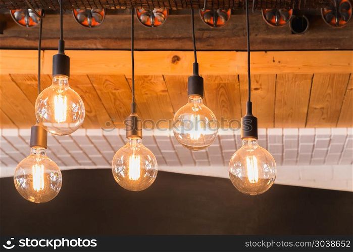 Decorative antique LED tungsten light bulbs hanging on ceiling.