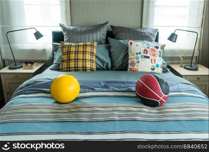 decorative bed with pillow and football at home
