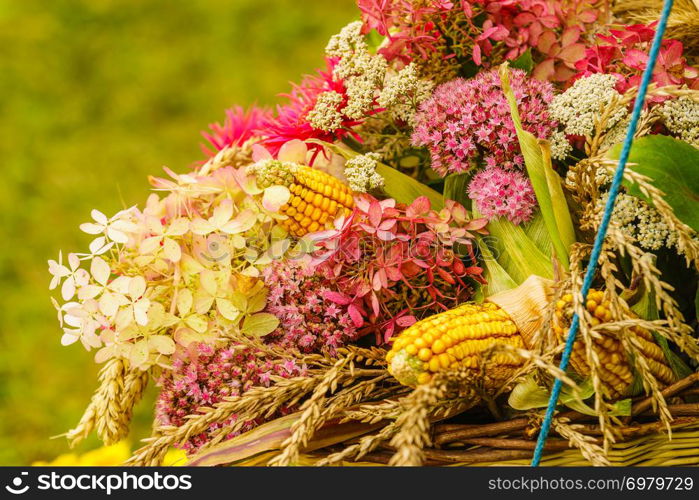 Decorative bouquet made of field flowers and hay. Folk decorations conept.. Bouquet made of field flowers and hay